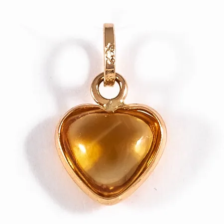 Hänge i 18K guld: Orange sten i form av hjärta. Det är 9,5 mm brett, 16 mm långt inkl. ögla och väger 0,6g.
