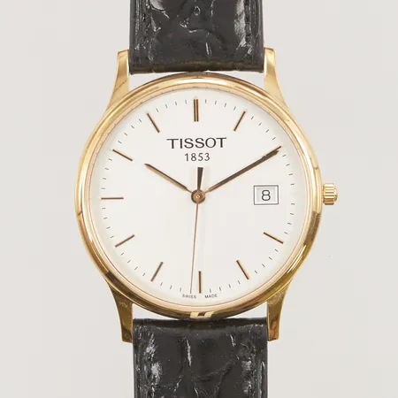 Herrur Tissot 1853 Quartz, går ej, graverad, 18K med läderband, ligger i ask. Vikt: 0 g
