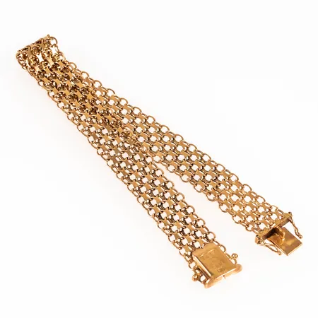 Armband, X-länk i 18K guld. Det är 20,5 cm långt, 12 mm brett och väger 13,9g. Kistlås. Stämplat SÄAB (Stockholms Ädelsmide AB), 18K, P9 (1965) & kattfot. 
