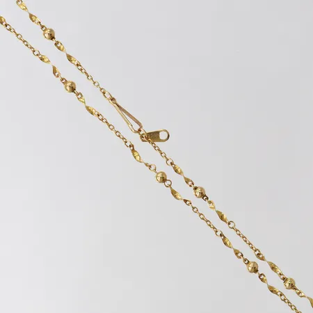 Kedja med integrerade kulor, längd 42cm, bredd 1-3mm, 18K.  Vikt: 3,7 g