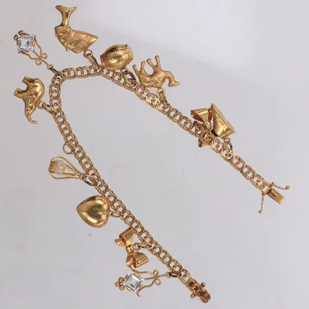 Armband med elva berlocker, längd 19cm, lätt buckla, 18K Vikt: 17,5 g