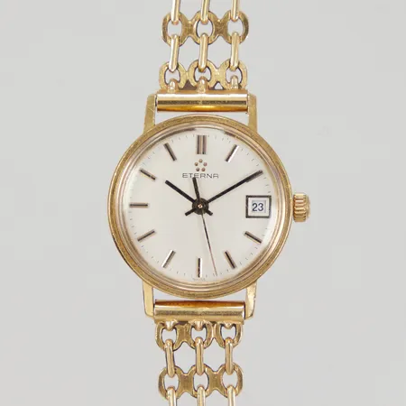 Damur Eterna 18K, Ø ca 22mm, quartz batteribyte krävs, datum, gravyr, integrerat armband 18K, total längd inkl ur ca 18cm, bredd 10,7mm, bruttovikt 26,7g 