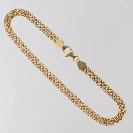 Armband X-länk, längd 19,5cm, bredd 4mm, 18K.  Vikt: 3,6 g
