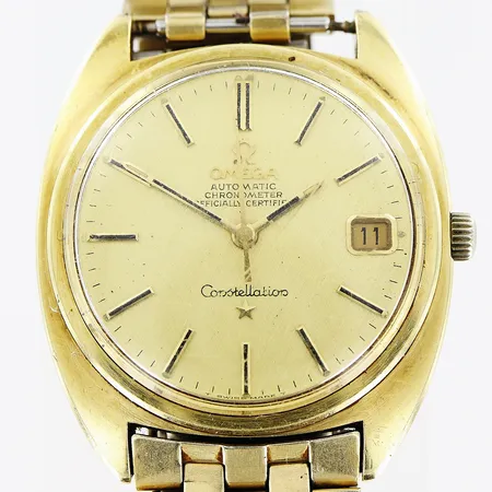 Herrur Omega Constellation, guld på stål, automatisk, Ø35mm, datum, klockan är i behov av service, länk defekt, inga tillbehör.