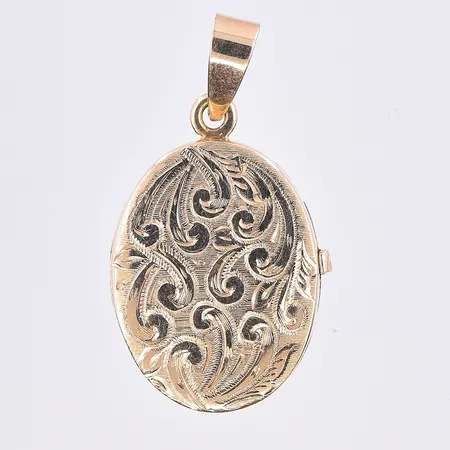 Hänge medaljong, längd 30 mm, bredd 16 mm, graverad baksida, 18K. Vikt: 4,3 g