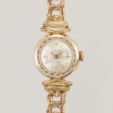 Damur Camy manuell, nr 14351, Ø17mm, 18K med länk i 18K bruttovikt 24,6g.