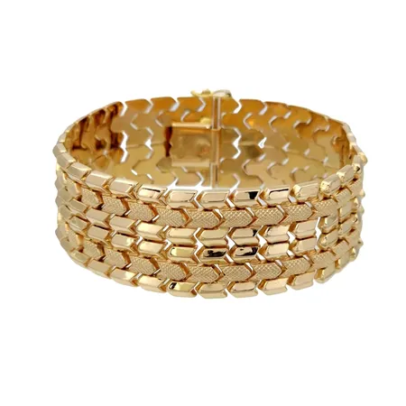 Armband, 18K guld, Italien, svensk kontrollstämpel, längd knäppt 19,0 cm, bredd 22,5 mm Vikt: 42,5 g