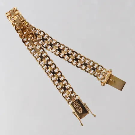 Armband X-länk, ca 17cm, bredd 8,5mm, tröga låsåttor. 18K  Vikt: 18,7 g