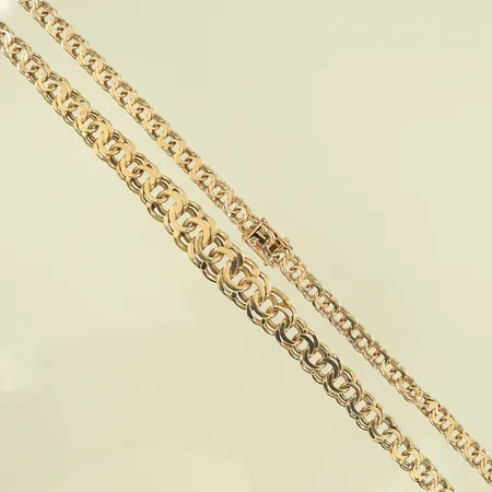 Halskedja, doserad bismarck, längd 43,5cm, bredd 5-9mm, skeva länkdelar, 14K, 19,5g Vikt: 19,5 g