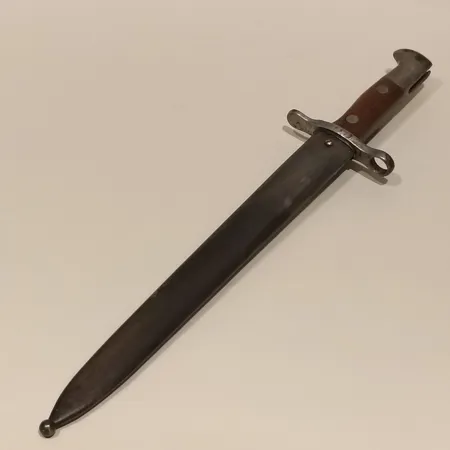 Sabelbajonett, M/1889, Maschinenfabrik, Bern, nr 126621, totallängd 42cm, bärläder, åldersbetingat slitage. Skickas med postpaket.