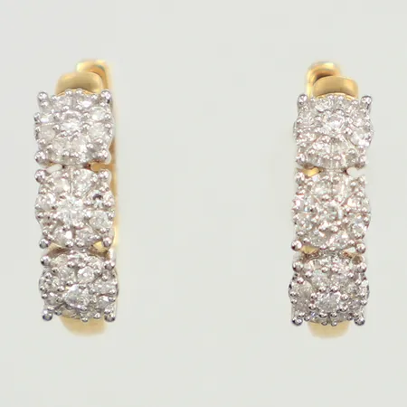 Ett par örhängen med diamanter 6x ca 0,01ct, 48x ca 0,005ct, Ø14,5mm, bredd 4mm, tvåfärgade, GHA, 18K  Vikt: 2,3 g