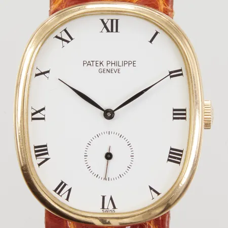 Herrur Patek Philippe Golden Ellipse, 18K, ref: 3948, manuell, ca 32x27mm, serienummer: 1358847, repor, läderarmband, originalspänne 18K, certifikat 1988, servicekvitto 2019