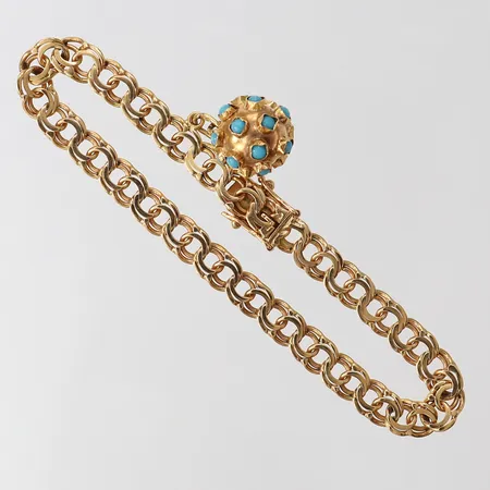 Armband med berlock, längd 19cm, bredd 6mm, 18K.  Vikt: 14 g