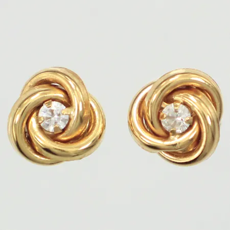 Ett par örhängen med vita stenar, bredd 7,7mm, 18K  Vikt: 1,1 g