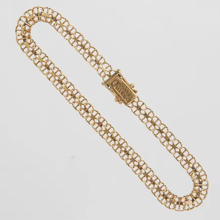 Armband, X-länk med stav, längd: 21,2cm, bredd: 5,8mm, svenska stämplar, 18K Vikt: 7,1 g