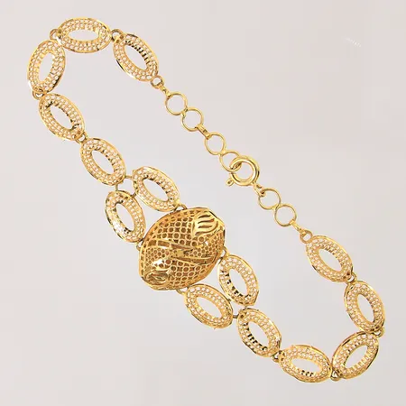 Armband med genombruten dekor, längd 17,5-19cm, bredd 6,7-19mm, 21K Vikt: 7,3 g