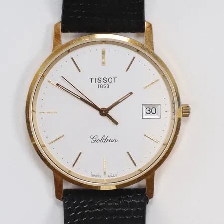 Herrur Tissot Goldrun 18K Ø33,5mm quartz (går ej, troligen batteribyte), datum, gravyr (företag), med defekt läderband 18K bruttovikt 28g