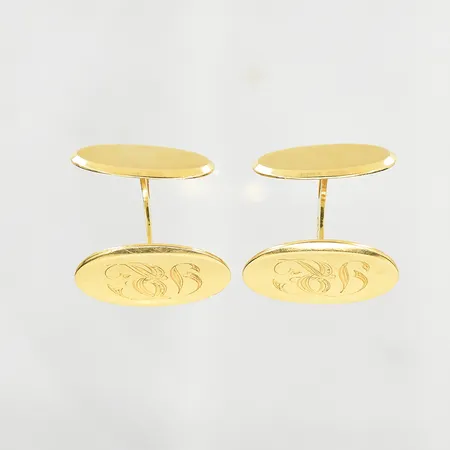 Ett par manschettknappar med monogram, stl 14x19 mm, 18K. Vikt: 6,9 g
