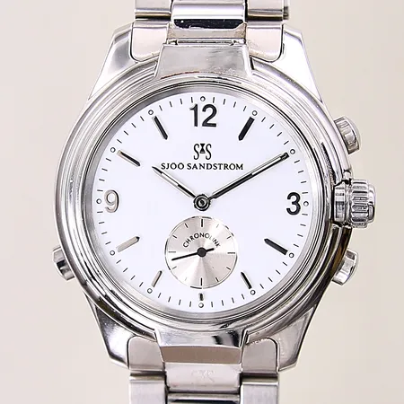 Herrur Sjöö Sandström Chronolink Worldtimer UTC, stål/titan, manuell/quartz, ref-nr: WT6202, serie-nr: 1180, Ø40mm, dag, datum, världstid, alarm, timer, stållänk, dubbelviklås, mindre repor, inga tillbehör