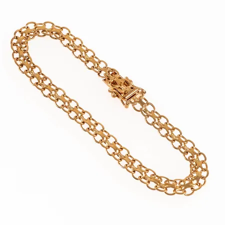 Armband, X-länk i 18K guld. Det är 19 cm långt, 6 mm brett och väger 7,5g. Kistlås. 18K & kattfot. 