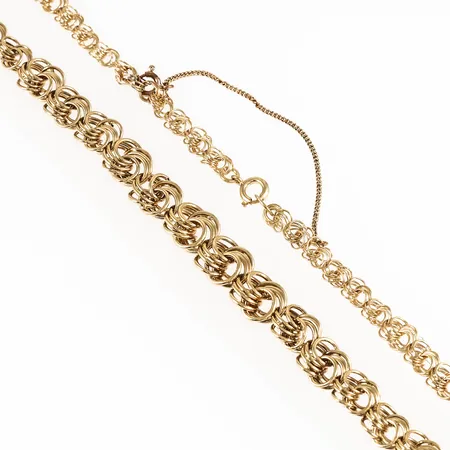 Collier i 14K guld. Det är 44 cm långt, 4,5 - 10,5 mm brett och väger 14,9g. Springring. Säkerhetskedja (ej guld). 