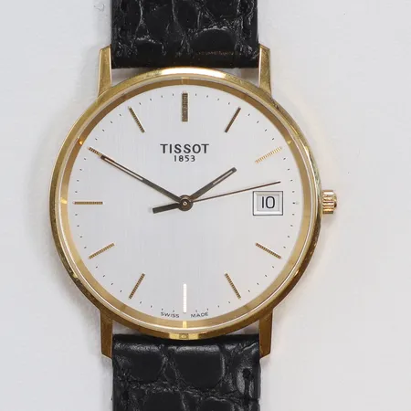 Herrur Tissot 18K Ø34mm, ref nr H674.330, quartz (går ej, troligen batteribyte), datum, gravyr (företag), med läderband guld i boetten, med originallåda, bruttovikt 29,2g