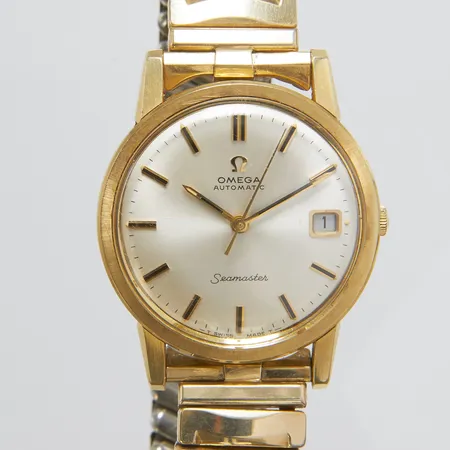 Herrur Omega Seamaster, guld på stål, automatisk, 34,5mm, refnr: 166.003, Cal. 565, verknr 25341812, datum, repigt glas, repig boett, flexband i metall ej original, dålig packning, inga tillbehör.