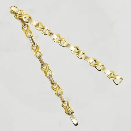 Armband, längd 18½ cm, bredd 6 mm, halvstel modell, gulguld/vitguld, 18K. Vikt: 14,3 g