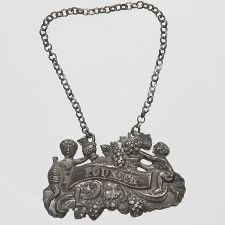 Karaffetikett, "Pounsch", 59,6x37mm, Adolf Lillja, Stockholm, 1846, missfärgad, silver Vikt: 9,9 g