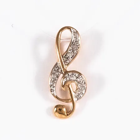 Hänge, G-klav i 18K guld med 2 x ca 0,005ct 8/8 slipade diamanter. Det är 6 mm brett, 14,5 mm långt och väger 0,5g. Framstår oanvänd. Stämplad GHA, 750.