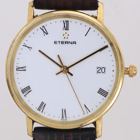 Herrur, Eterna, 18K, 33,5mm, quartz (går ej), datum, defekt krona, gravyr, läderband med slitage, inga tillbehör