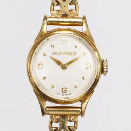 Damur, Movado, boett i 18K, manuell, Ø19,5mm, med x-länk i 18K, längd ca15,5mm, bredd 7,5-20,5mm,Boman E, år 1592, behov av batteribyte, bruttovikt 21,1g