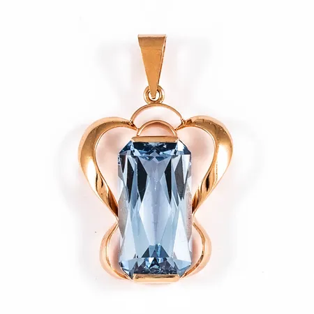 Hänge i 18K guld med ljusblå sten 9,4 x 18 mm. Det är 20 mm brett, 33 mm långt inkl ögla och väger 4,4g. 