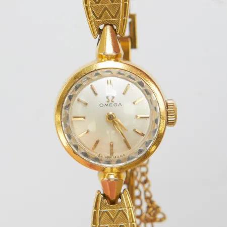 Damur, Omega, doublé, Ø17mm, manuell, plexiglas, länk samt säkerhetskedja i 18K, bruttovikt 21,2g