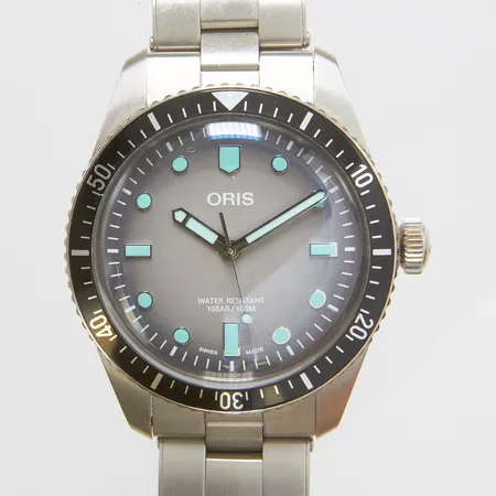 Herrur Oris Sixty-Five, stål, automatisk, 39mm, ref: 01 733 7707 4053, snr: 39 29462, boettnr: 7707-4000, stållänk, viklås, certifikat, manual, box, defekt ytterkartong