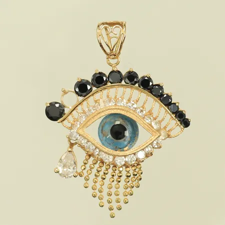 Hänge med "öga" samt vita & svarta stenar, 1 sten saknas och några vita är limmade, 18K 6,1g totalt.