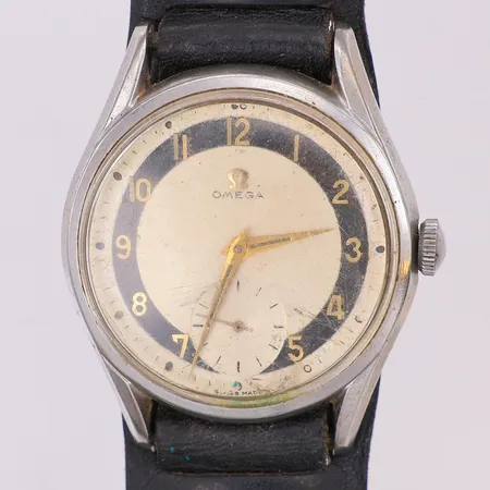Herrur Omega Tuxedo, 50-tal, manuell, läderband ej original, går ej, glas naggat i nederkant, kronan lös