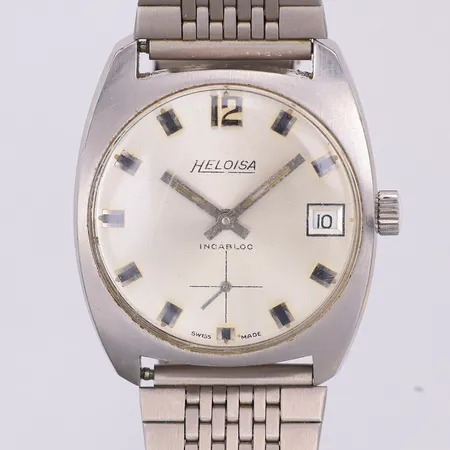 Herrur Heloisa, manuell, datum, 33,5 x 33mm, stål, 70-tal, armband, stål, viklås, ca 20cm, repigt glas