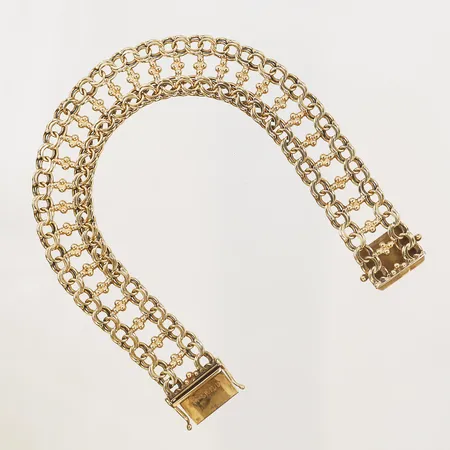 Armband, Götes Guldvaror, Göte Engström, Köping år 1983, längd: 19,5 cm, bredd: 14 mm, 18K guld. Vikt: 22,9 g