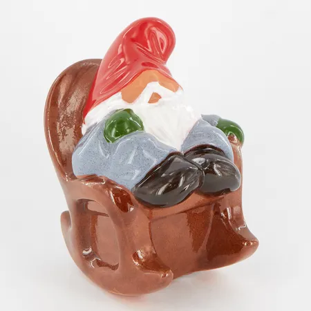 Figurin, sovande tomte i gungstol, design Rolf Berg, Torshälla Sweden, höjd ca 12cm, etikettmärkt Skickas med paket.