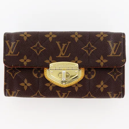 Plånbok Louis Vuitton, modell M66556, monogramcanvas, beslag i gulmetall smärre färgbortfall, 6 kortfack, 6 övriga fack varav ett med dragkedja, dustbag, box, inga övriga tillbehör.