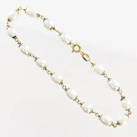 Armband, 18,5cm, odlade pärlor ca 6x4mm, skevheter, tillverkningsdefekter, 18K. Bruttovikt: 5,4gram.  Vikt: 5,4 g