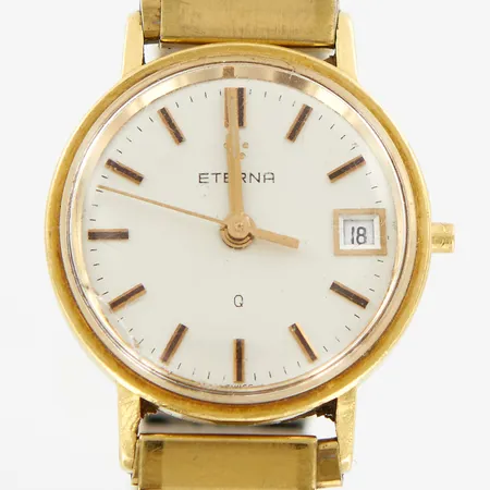 Damur Eterna, Ø22mm, quartz, 18K i boett, flexilänk i gulmetall, graverad, defekt saknar krona