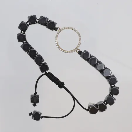 Armband med svarta stenar, mittdel i guld 18K med vita stenar, bredd 6-13mm, bruttovikt 19,1g