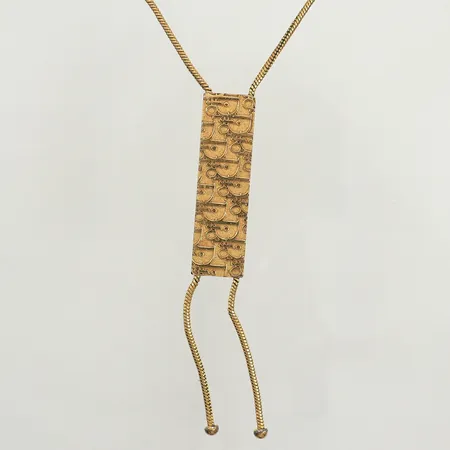 Collier Christian Dior, dekor av logga i relief ca 47cm, bredd 15mm, guldpläterad metall, vintage, troligen -80 eller 90-tal, slitage på förgyllningen Vikt: 0 g