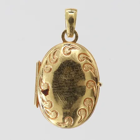 Hänge medaljong, 20x11,5mm ink ögla, plats på insidan, 18K.  Vikt: 1,1 g