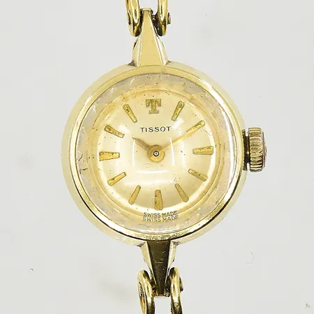 Damur Tissot 14K med X-länk 18K, boett Ø17 mm, manuell, utbytt krona, fungerade vid testtillfället, bruttovikt 18,8g.