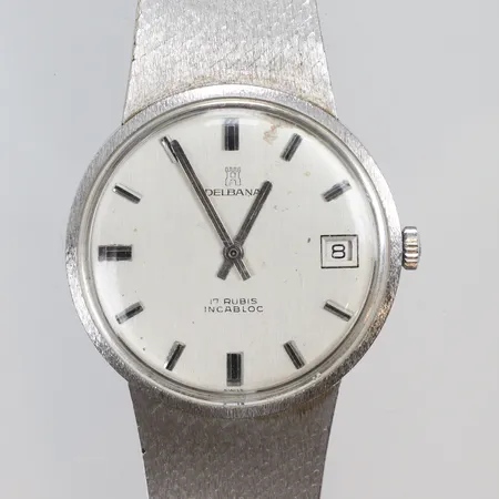 Herrur Delbana Ø34,5mm, länk i 18K, boett i 14K, boett nr. 75.18, manuell uppdragning, 17 rubis incabloc, datum, urtavla med slitage, sekundvisare saknas, ca 1970-tal, vitguld, bruttovikt