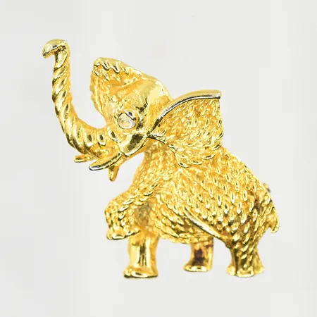 Brosch elefant med vita stenar, längd 49 mm, bredd 30 mm, förgylld metall.
