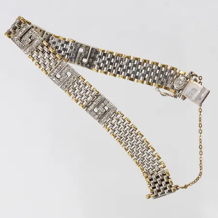 Armband med diamanter ca 75 x 0,01ct, längd 17,5cm, bredd ca 10mm, tvåtonad, säkerhetskedja, 18K Vikt: 22 g